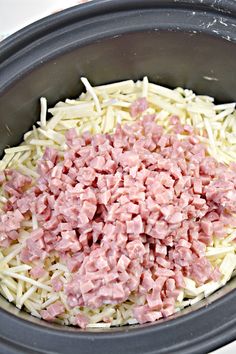 ham and cheese are mixed together in the crock pot