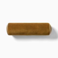 a roll of brown fabric on a white background