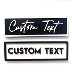 two black and white signs that say custom text