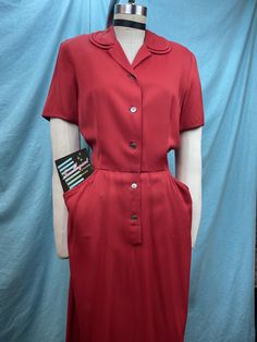 "1940s/1950s W:29 Maryell Modes of Dallas Vintage 40s 50s Deep carmine red rayon gabardine double peter pan collar V neckline button up hip pocket A-line skirt day dress Beautiful vintage dress by Maryell Modes of Dallas. 40s 50s day dress in very deep carmine red color made out of medium weight great quality rayon gabardine. Double Peter Pan collar with a button up closure. Mid length sleeve. Fitted waist and darted skirt with hip pockets. Unlined. Built in shoulder pads. Pinned of mannequin si 1950s Collared Dresses With Buttons, Vintage Semi-formal Dresses With Button Closure, Semi-formal Vintage Dresses With Button Closure, Collared Vintage Dress With Buttons For Vintage Fashion, Classic Short Sleeve Lined Vintage Dress, Collared Vintage Dress With Buttons, Vintage Semi-formal Dresses With Buttons, Vintage Dress With Button Closure For Work, Vintage Workwear Dress With Button Closure