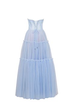 Dreamy tulle dress in light blue color with a light ruffled tulle maxi skirt. This dress has a heart-shaped boned semi-transparent bodice with built-in cups and a corset back, which makes the silhouette fitted and elegant. The A-line maxi skirt is made from multiple layers of delicate tulle that emphasize the hourglass silhouette. The waistline is adorned with a silver belt with Milla’s signature. Details: Material: Tulle Fabric composition: 100% Polyester, 100% Nylon Sleeve style: Sleeveless Si Sheer Tulle Maxi Dress For Prom Season, Spring Tulle Gown With Sheer Bodice, Blue Gown With Tulle Skirt And Fitted Bodice, Voluminous Tulle Floor-length Dress, Floor-length Voluminous Tulle Dress, Voluminous Floor-length Tulle Dress, Blue Tulle Dresses With Corset Back, Blue Tulle Dress With Boned Bodice, Blue Ruffled Corset Dress For Wedding