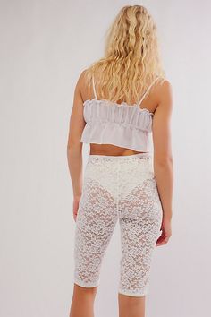 So lovely in lace, these floral-adorned capri pants are featured in a high-rise silhouette and slim-fitting style with bow-tie detail at the center-front and picot trim. **Fit:** High-rise, fitted silhouette, knee length **Features:** Sheer lace fabrication with floral detailing, elasticated waistband, bow-tie at center-front, defined seams, picot trim **Why We ❤ It:** These lace pants can be layered underneath all your favorite dresses and skirts or paired with a tunic. | All Day Lace Capris by Feminine Lace Stretch Bottoms, Chic Fitted Bottoms With Delicate Lace, Fitted Flirty Bottoms With Lace Trim, Fitted Lace Bottoms For Daywear, Flirty Fitted Bottoms With Lace Trim, Fitted Summer Bottoms With Delicate Lace, Fitted Bottoms With Delicate Lace For Summer, High Waist Lace Bottoms With Lace Trim, High-waist Bottoms With Lace Trim