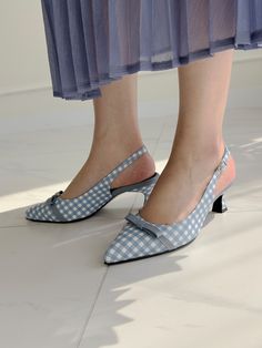 Editor's NoteMURINA presents feminine and sophisticated footwear that completes your style.- Checkerboard pattern slingback- Lovely ribbon point- Soft fit with cushion detail- Size adjustable with the buckle Measurements (in.)- Size: KR 225 - KR 250MM (US 5.5 - 8)- Heel Height: 1.97 in. Composition & Care- Sheep Leather- Natural leather may have fine scratches and wrinkles- Bright leather can get stained by denim or dark outfits- Avoid direct heat and moisture- Wipe off moisture an Spring Low Heel Shoes With Bow Straps, Spring Low Heel Heels With Bow Straps, Spring Bow Straps Low Heels, Summer High Heel Slingback Pumps With Bow Straps, Summer Slingback Pumps With Bow Straps And Open Toe, Summer Open Toe Slingback Pumps With Bow Straps, Chic Summer Kitten Heels With Bow Straps, Chic Spring Kitten Heels With Bow Straps, Summer Slingback Sandals With Bow Straps