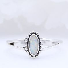 Metal Type: Sterling Silver  Metal Stamp: 925 Gemstone Type: Lab White Opal Gemstone Shape: Oval  Center Stone Measurements: 6mm x 4mm Gemstone Creation Method: Simulated  Ring Measurements:  5mm Available in different metal colors and stone colors as well. Please message me for inquiry! Classic Adjustable Opal Ring For Anniversary, Oval Opal Stackable Rings, Stackable Oval Opal Rings, Classic Silver Opal Ring Oval Cabochon, Classic Sterling Silver Opal Birthstone Ring, Nickel Free Oval Opal Ring For Anniversary, Oval Opal Stackable Jewelry, Silver Oval Stackable Rings With Birthstone, Oval Opal Stackable Rings As Gift