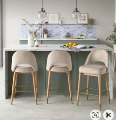 three stools in front of a kitchen island with marble counter tops and gray walls