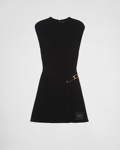 Fit and flare Unlined Round neck Back zipper closure Sleeveless Leather logo label Flared hem Safety pin detail on the faux wrap skirt Vintage Prada Dress, Prada Dress Couture, Prada Clothes Women, Prada Outfits Women, Luxury Skirt, Prada Clothes, Prada Runway, Printed Satin Dress, Prada Dress