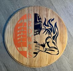 a wooden sign with an image of a football player and the words auburn state on it