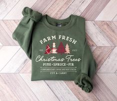 Farm Fresh Christmas Trees Sweatshirt Tree Farm Shirt for Christmas Sweatshirt Most Wonderful Time Merry Christmas Sweater Christmas Shirt 🛒👕 Welcome to Scents and Sips Gift Co! Here's your step-by-step guide to ordering: 1️⃣ Review all details before ordering. 2️⃣ Pick your size & style from the dropdown menu. 3️⃣ Select your favorite color from the dropdown and add to cart. 4️⃣ Want more? Hit 'back' & repeat steps 1-3. 5️⃣ When your cart's ready, add payment & shipping info, then hit submit. 📏 Not sure about size? Check our size chart in the pictures! ⏱️ Processing: 1-2 business days. 🚚 Shipping: Speedy options! First Class: 1-5 business days. Priority: 2-3 business days. Express: 1-2 business days. 👕 Care Instructions: No dry cleaning or direct ironing on design. Machine wash insid Western Sweatshirts, Christmas Western, New Years Shirts, Cowboy Christmas, Fresh Christmas Trees, Merry Christmas Shirts, Winter Shirts, Funny Christmas Shirts, Sweatshirt Christmas