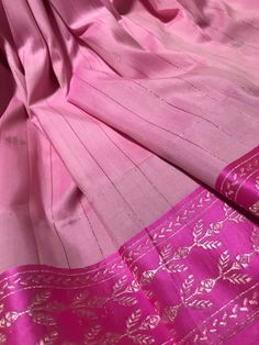 This is. a banarasi SILK By SILK COTTON saree in candy pink with pinkish zari lines running vertically all over the body. Muted silverish gold zari pallu and woven zari motifs complete this saree. Saree is finished with tassels and falls and pico are already  done.  Saree comes with an unstitched blouse piece(last picture) *Handloom products may have some irregularities  *Colour may vary slightly due to lighting  *Dry clean only *All sales are final Banasari Saree Silk, Banarasi Katan Silk Saree, Peach Saree, Silk Cotton Sarees, Saree Trends, Indian Clothing, Candy Pink, Pink Saree, Pink Candy