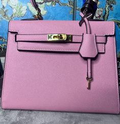 This fun, flirty, bubblegum pink with gold hardware, tiny tote is the cutest purse you will ever own! It comes with a lock and key and a little hide a key accoutrement! Hide A Key, Pink Handbags, Cute Purses, Bubblegum Pink, Bubble Gum, Gold Hardware, Purses And Handbags, Top Handle Bag, Handbags