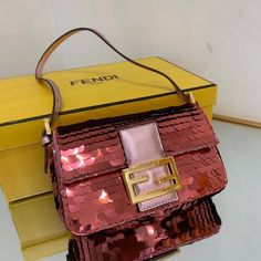 SHOP MORE LUXURY PRODUCTS HERE Description Fendi Mini Baguette 1997 Pink Sequinned Bag For Woman 19.5cm/7.5in 8BS049AISLF1H37 Size: 19.5 x 5 x 11 cm / 7.5 x 2 x 4.5 inch Mini 1997 Baguette bag with all-over pink metallic sequin embroidery, embellished with an FF clasp.This style is a re-release of the first Fendi Baguette, created in 1997, from which it takes its name and the iconic design to wear under the arm.Featuring a front flap, rose-gold leather details and a magnetic clasp. Satin-lined i Luxury Baguette Bag For Shopping, Designer Pink Baguette Bag For Shopping, Designer Pink Baguette Shoulder Bag, Luxury Baguette Bag For Party, Pink Baguette Bag With Gold-tone Hardware For Evening, Pink Evening Baguette Bag With Gold-tone Hardware, Designer Pink Baguette Bag With Detachable Strap, Designer Gold Rectangular Baguette Bag, Designer Gold Baguette Bag In Rectangular Shape