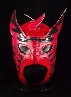 a red leather mask with horns on it