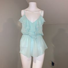 A Beautiful Baby Blue She Organza Material With The Ruffle Front And Adjustable Spaghetti Straps New With Tags Never Worn Blue Ruffled Top With Spaghetti Straps, Blue Ruffled Spaghetti Strap Top, Blue Spaghetti Strap Top With Ruffles, Organza Ruffle Top, Neon Yellow Tops, Red Scrubs, Organza Material, Blue Organza, Basic Long Sleeve Tee