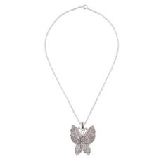 The wings of a beautiful nocturnal butterfly are captured in sterling silver featuring marvelous handcrafted filigree openwork. Nancy Quispe of Peru works in the hope of opening a school for young artisans designing this accessory. Elegant Butterfly Filigree Jewelry, Elegant Butterfly Shaped Filigree Jewelry, Elegant Silver Butterfly Necklace In Sterling Silver, Silver Butterfly Necklace With Butterfly Clasp, Elegant Silver Butterfly Necklace With Butterfly Clasp, Sterling Silver Jewelry With Butterfly Clasp, Silver Sterling Silver Jewelry With Butterfly Clasp, Silver Sterling Butterfly Necklace, Silver Sterling Butterfly Necklace With Butterfly Clasp