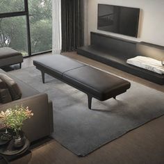 a living room filled with furniture and a flat screen tv on top of a wall