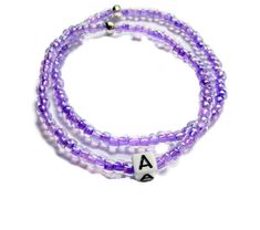 This set of two light purple seed bead bracelets is personalized with an initial of your choice. The beads are on a stretch cord and fits most sizes. The purple color of the beads is so pretty. Personalized gifts are special gifts to give to special people.  This is a stackable bracelet set.  Seed beaded bracelets make great christmas gifts, gift for her, or treat yourself.  You receive it in a gift box and it is ready to give.  Made on the top of the mountain with fresh air and beautiful views. Handmade Purple Name Bracelet With Round Beads, Purple Stretch Bracelet With Tiny Beads As Gift, Lavender Bracelets With Tiny Beads For Gift, Purple Beaded Bracelet With Letter Beads As Gift, Lavender Beaded Bracelet With Tiny Beads For Gifts, Purple Stretch Bracelet With Letter Beads For Gift, Personalized Purple Stretch Bracelet With Round Beads, Purple Beaded Name Bracelet With Round Beads, Purple Stretch Bracelet With Letter Beads As Gift