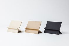 three different types of boxes sitting on top of each other in front of a white background