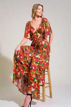 A printed woven maxi dress featuring sweetheart neckline, short sleeve, waist yoke, pleated layered skirt and back zipper closure Details: Self : 100% PolyesterLining : 100% Polyester Size & Fit - Model is 5`8" And Wearing Size Small- Measurements Taken From Size Small- Approx. Length: 58" Chic Multicolor Tiered Maxi Dress, Retro V-neck Dress With Vibrant Print, Green Short Sleeve Maxi Dress For Party, Bohemian Short Sleeve Midi Dress For Party, Multicolor Tiered Maxi Dress For Party, Chic Short Sleeve Midi Dress With Vibrant Print, Green Printed A-line Maxi Dress, Bohemian Short Sleeve Dress With Vibrant Print, Short Sleeve Printed Maxi Dress For Parties