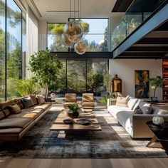 a living room filled with lots of furniture and large glass windows on the wall above it