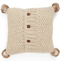 a crocheted pillow with pom - poms on the front and back