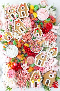 an assortment of decorated cookies and candies on a table