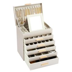 a white jewelry box filled with lots of drawers