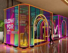 an artist's rendering of the inside of a building with neon colored walls and arches