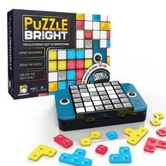 the puzzle bright board game is next to it's box and its contents are scattered around