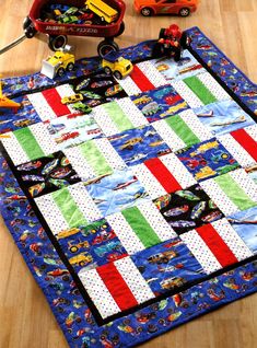 a child's play mat with cars and trucks on the floor next to it