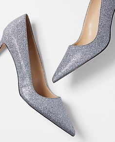 Elevate your evening ensemble with the Ann Taylor Glitter Straight Heel Pumps, where elegance meets a sparkling allure. These pumps feature a sleek, pointy toe design that adds a touch of sophistication to any outfit.

- Size: 6
- Color: Silver
- Gender: Female
- Material: 50% Polyurethane, 30% Polyethylene Terephthalate, 20% Polyester
- Heel Height: 3 inches

Crafted for comfort and style, these pumps come with a padded footbed ensuring you can dance the night away without a second thought. The Glitter Pumps, Polyethylene Terephthalate, Heel Pumps, Toe Designs, Silver Glitter, Pumps Heels, Effortless Style, Ann Taylor, Gender Female