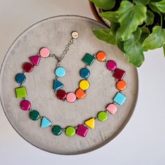 "This colorful geometric necklace is perfect finish for both casual and formal outfit. Hand made with wooden elements and covered with epoxy resin, the necklace can be special self gift, or elegant gift for mothers day. Bring a personal touch in your wardrobe by choosing jewelry made by hand with attention to every detail. The full length of the necklace is 60 cm. The chain is nickel free. Please keep in mind that colors may vary slightly from those viewed on your monitor. Please note that every piece is an original and hence each set may slightly different from the picture shown. Please see \"Shop Policies\" section for more important information about shipping, refunds, custom options and more. CARE INSTRUCTIONS - store in a clean, dry place. Use of oils, creams, perfumes etc may effect Retro Long Necklace As A Gift, Retro Long Necklace For Gift, Modern Handmade Multicolor Necklaces, Modern Handmade Multicolor Necklace, Trendy Handmade Resin Necklace, Retro Geometric Jewelry For Gifts, Retro Geometric Jewelry Gift, Self Gift, Gift For Mothers Day