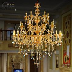 a fancy chandelier hanging from the ceiling in a living room or dining room