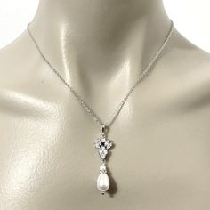 "A set of pearl drop bridal jewelry set with marquise earrings and teardrop necklace, made of sparkly cubic zirconia and swarovski pearls in silver rhodium plated tarnish-resistant base. Earrings are about 1 3/8\" (3.6cm). Pendant is about 1 3/4\" (4.5cm) with bail. Chain length can be added with a 2\" extender chain. View matching pieces or similar designs at https://etsy.me/2uIu6QL View designs with marquise shapes at https://etsy.me/2flzzGg View all necklace and earrings sets at https://etsy. Marquise Bridal, Marquise Earrings, Earrings Sets, Crystal Earrings Wedding, Bridal Earrings Drop, Bridal Jewelry Set, Cubic Zirconia Jewelry, Vintage Style Wedding, Teardrop Necklace