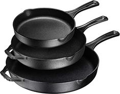 three black pans stacked on top of each other