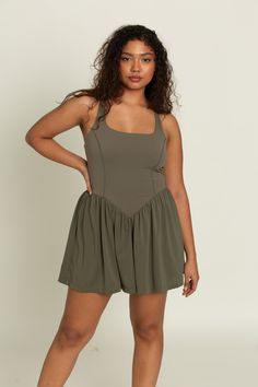 Our Olive Cross Back Corset Dress is the dress you've been dreaming about. It has everything you could ask for and more. Built in spandex shorts with hidden pockets to hold your essentials, adjustable straps and a built in bra with removable padding to give support when you need it. Throw a jacket over this dress for an evening out or put on some tennis shoes and wear it to the courts, the options are endless! Fitted Summer Maternity Activewear, Workout Dress With Built-in Shorts And Stretch, Summer Activewear With Built-in Bra And Short Length, Summer Activewear With Built-in Bra In Short Length, Sleeveless Stretch Swim Dress With Adjustable Straps, Fitted Casual Swim Dress With Built-in Bra, Casual Fitted Swim Dress With Built-in Bra, Workout Dresses With Built-in Bra And 4-way Stretch, Back Corset Dress