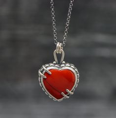 ♦Special Features: This necklace features a red Rosarita heart set in sterling silver. Rosarita isn't a stone but a glass slag from the gold mining industry from the 60's and 70's in Alaska. The beach sand would be refined and smelted for its gold content in these vats right on the beach. Because the process wasn't a perfect way to extract all the gold from the sand the resulting slag that built up is colored red from the gold left behind. I do love this material and it is so pretty with the var Artisan Heart-shaped Jewelry For Anniversary, Heart Cut Jewelry For Valentine's Day Collectibles, One Of A Kind Heart Jewelry For Anniversary, Heart Cut Collectible Jewelry For Valentine's Day, Collectible Heart Cut Jewelry For Valentine's Day, Red Sterling Silver Necklace With Heart Pendant, Red Necklace With Polished Finish As Gift, Red Necklace With Polished Finish For Gift, Unique Red Heart Shaped Jewelry