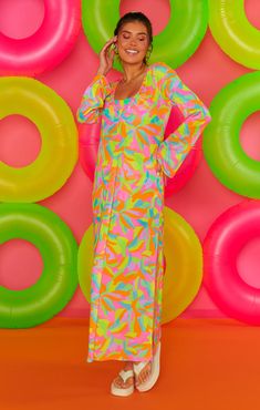 Beach bound with drink in hand in this vibrant rainbow coverup. The Santos Coverup is a mesh maxi with long sleeves and a v-neck. Throw on over a bikini with strappy sandals and straw hat for the perfect vacay vibe! Straw Hat, Strappy Sandals, Straw, Cover Up, Neon, Rainbow, V Neck, Long Sleeve, Santos