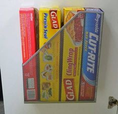 a white refrigerator freezer sitting inside of a kitchen next to a shelf filled with food