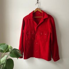 "1950's red wool shirt jacket, excellent vintage condition! Unisex, warm, 2 front pockets, missing a couple buttons.  (I will look yet, I may have replacements) length 27\" chest 20\" shoulder 17\" sleeve 23\" shoulder to cuff Thanks for stopping and feel free to ask any questions!" Vintage Winter Shacket With Pockets, Vintage Winter Shacket With Button Closure, Vintage Winter Tops With Pockets, Vintage Red Button-up Outerwear, Vintage Collared Shacket With Button Closure, Vintage Red Wool Outerwear, Red Vintage Wool Outerwear, Vintage Red Single-breasted Outerwear, Retro Red Tops With Pockets