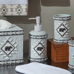 bathroom accessories including soap dispenser, toothbrush holder and tissue dispenser