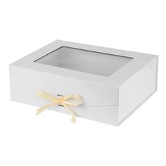 a white box with a yellow bow on the top and bottom, it is empty