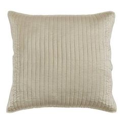 a beige pillow with pleated lines on the front and back, sitting on a white background