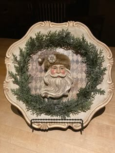 a decorative plate with a santa clause on it