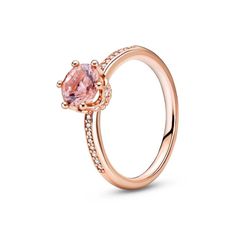 From Pandora, go for a glamorous look with the Pink Sparkling Crown Solitaire Ring. Hand-finished in a 14k rose gold-plated unique metal blend, this pink crown ring is inspired by the Pandora Crown O monogram. Featuring one glittering pink crystal claw-set in the shape of a crown, clear cubic zirconia appear on top of the ring shank and on the sides of the crown setting. A piece fit for royalty, stand out in this eye-catching design. This ring is a size 4.5. Pandora Style#: 188289C01-48 Silver Wedding Gifts, Pandora Inspiration, Tiffany Rings, Pandora Pink, Pandora Rose, Simple Engagement, Dainty Rings, Pink Crown, Bracelet Pandora