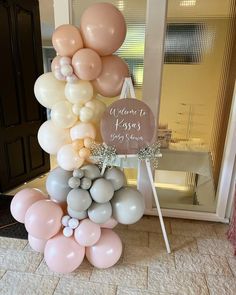 a bunch of balloons that are on top of each other in front of a door