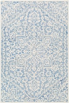 a blue and white rug with an intricate design