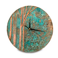 a clock with trees painted on it