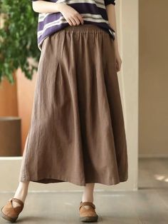 Olivia Mark - Vintage Coffee-Colored Linen Pleated A-Line Skirt with Folded Waist Detail Non-stretch Brown Skirt With Pockets, Non-stretch Brown Cotton Skirt, Casual Ankle-length Lined Skirt, Brown Skirt For Spring, Brown Spring Skirt, Brown Solid Color Long Skirt, Casual Flared Skirt In Solid Color, Brown Pleated Cotton Bottoms, Casual Pleated Wide-leg Skirt