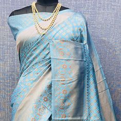 Light Blue colored saree is made from banarasi silk fabric which is highlighted with beautiful weaving work as shown. Comes along with unstitched banarasi silk blouse piece which you can customise as per your design/style. Occasion - You can wear this saree for festivals and functions. Note:- the actual product may differ slightly in color and design from the one illustrated in the images when compared with computer or mobile screen. Measurements: Saree : Banarasi Silk : 5.5 Mtrs Blouse : Banarasi Silk : 0.8 Mtr Material: Banarasi Silk Stitch Type: Unstitched Country of Origin: India Care Guide: Dry Clean Blue Bollywood Banarasi Silk Pre-draped Saree, Blue Art Silk Pre-draped Saree With Traditional Patterns, Blue Jamawar Pre-draped Saree With Zari Weaving, Blue Cotton Silk Pre-draped Saree With Zari Weaving, Blue Pre-draped Saree With Zari Weaving, Blue Art Silk Blouse Piece With Traditional Patterns, Designer Blue Saree With Traditional Patterns, Elegant Blue Blouse Piece With Traditional Patterns, Elegant Blue Blouse With Traditional Patterns