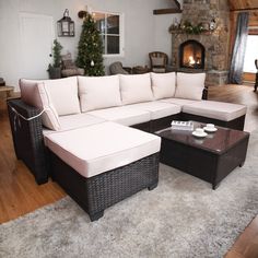 a living room filled with furniture on top of a white carpeted floor next to a fire place